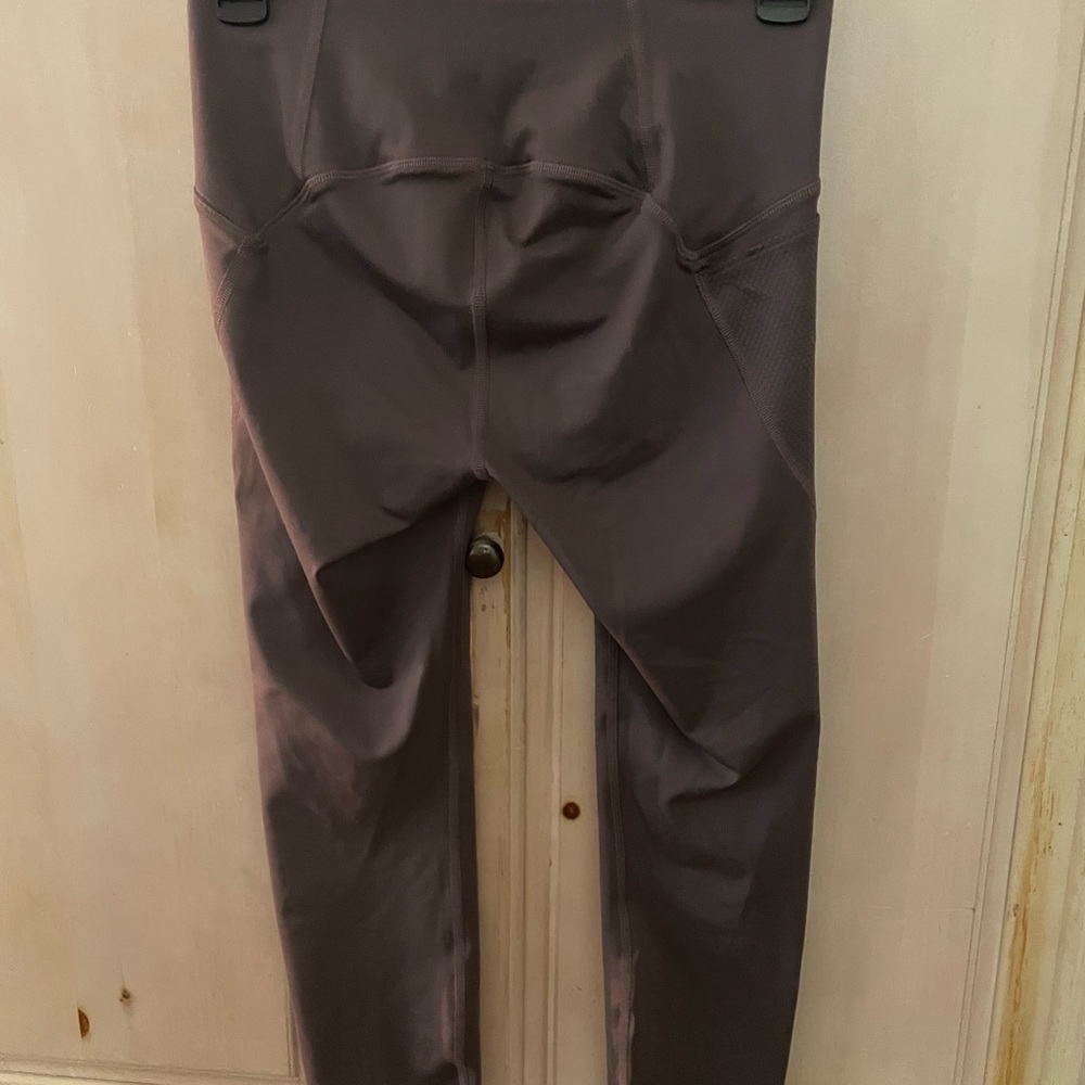 Small, purple with pockets. Like new